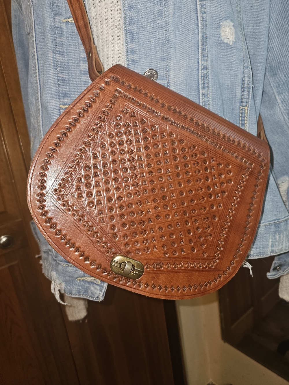Handcrafted Brown Leather Crossbody Bag with Embossed Detail